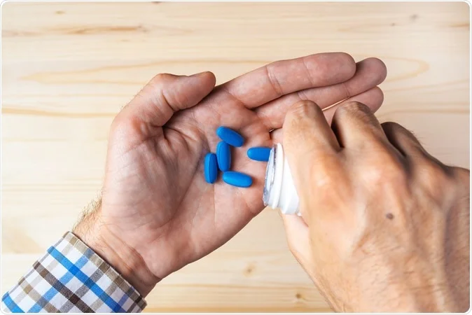 man taking pills
